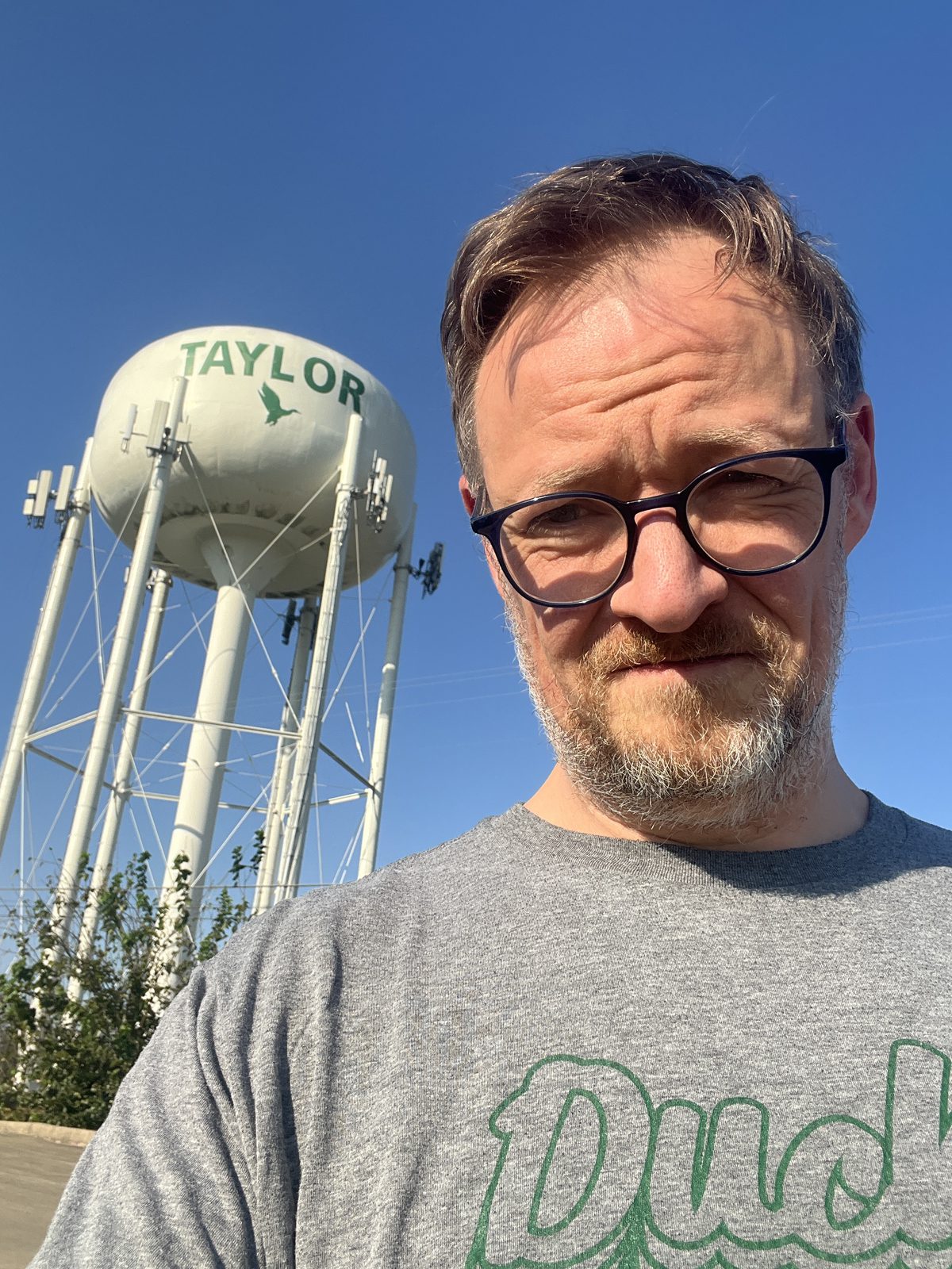 John Bongaarts in front of the Taylor water tower